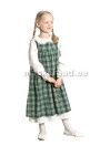 Vanaaegne tütarlaps roheliseruudulises pealiskleidis